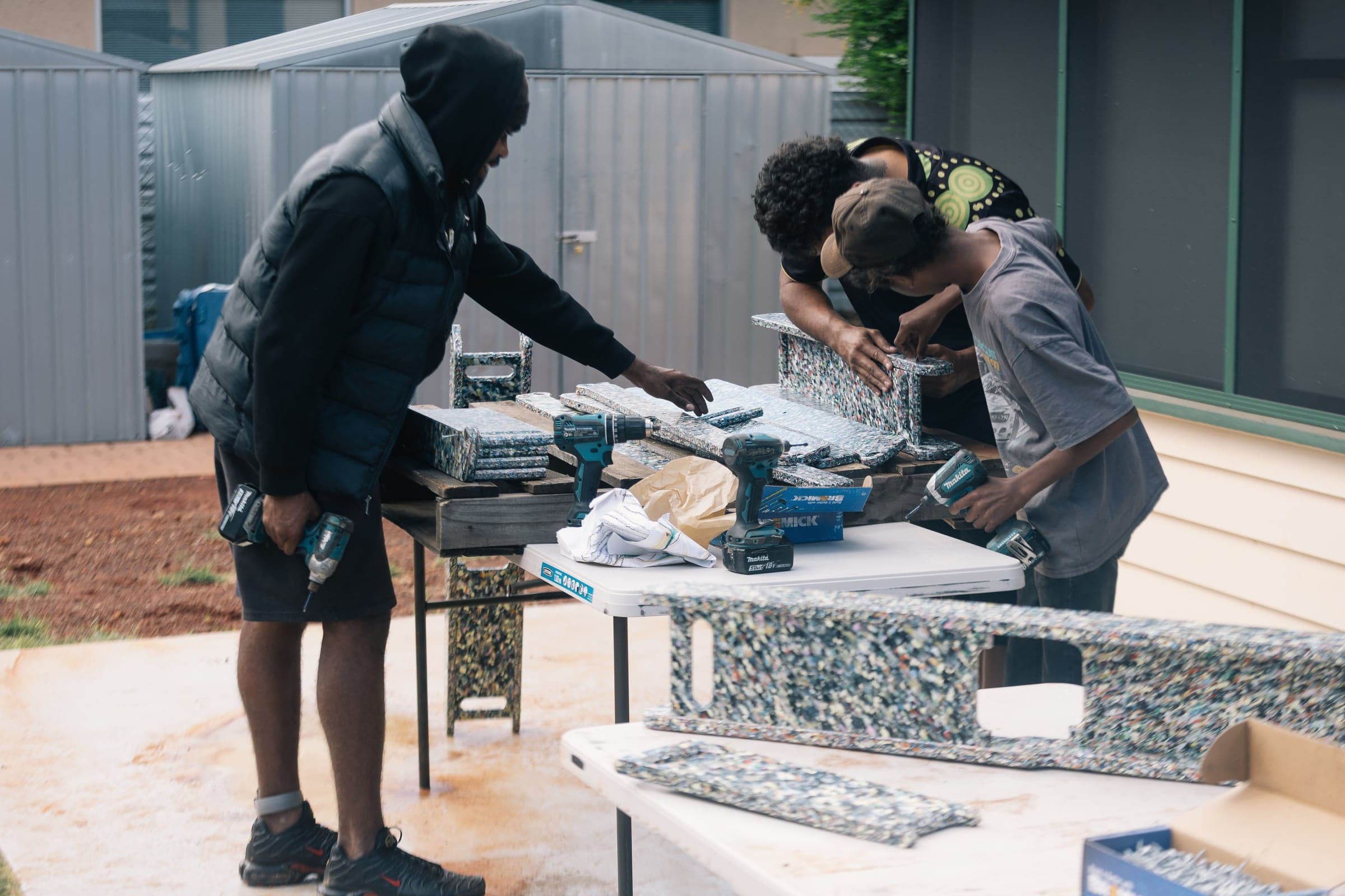 Young people assembling Stretch Bed components in Alice Springs