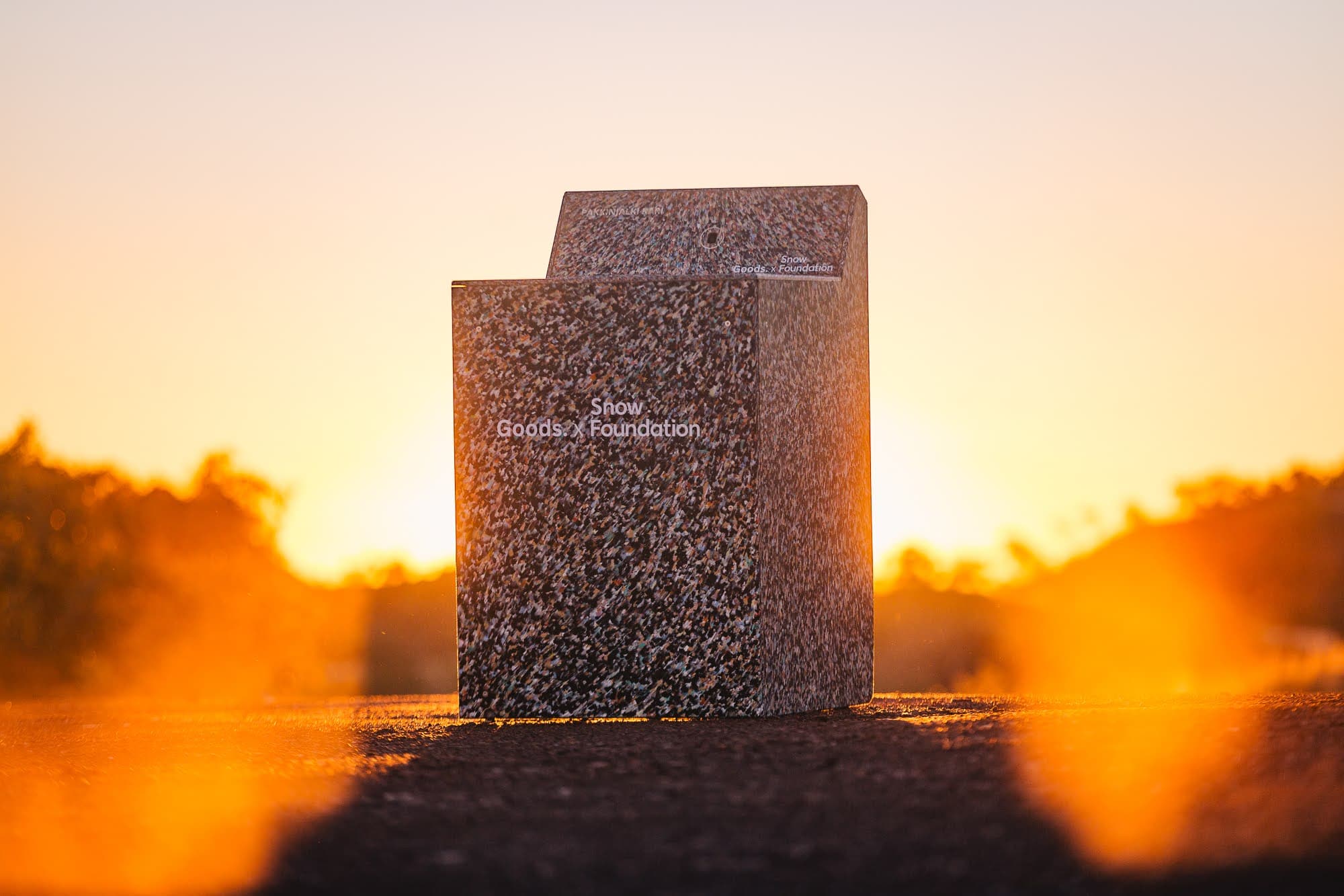 Recycled plastic washing machine enclosure at sunset