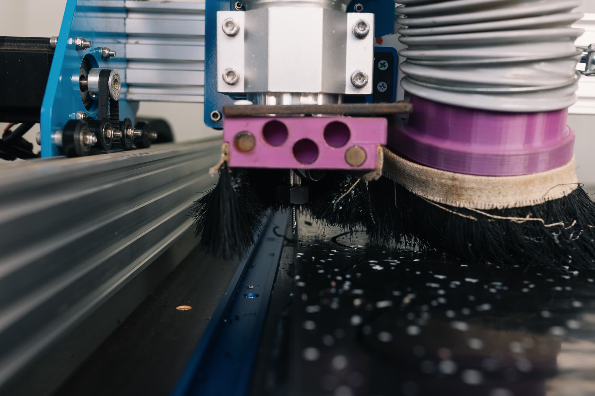 Close-up of a CNC router cutting an HDPE leg blank