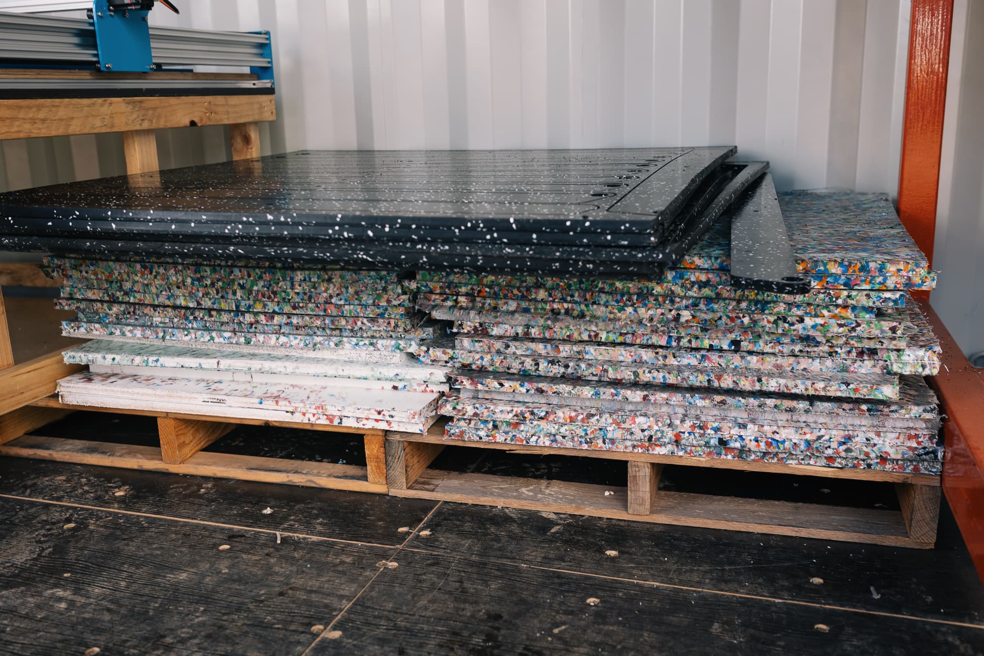 Stacked pressed HDPE sheets fresh from the heat press