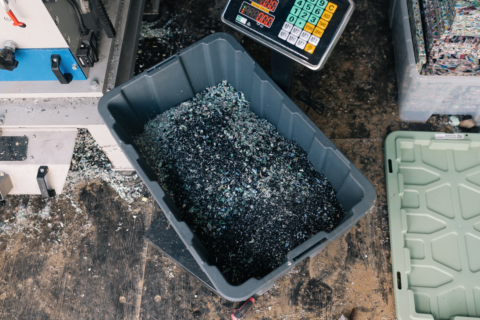 Shredded plastic chip on a scale ready to be weighed