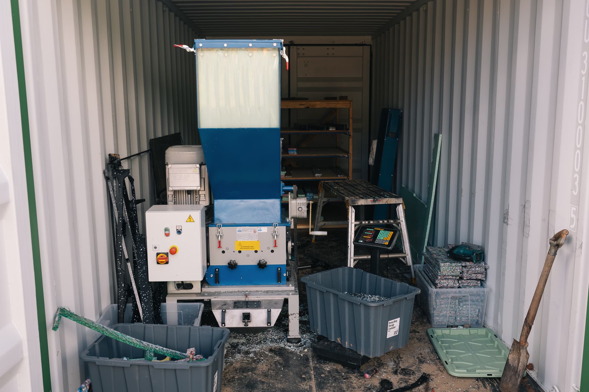 Industrial granulator shredding HDPE into chip