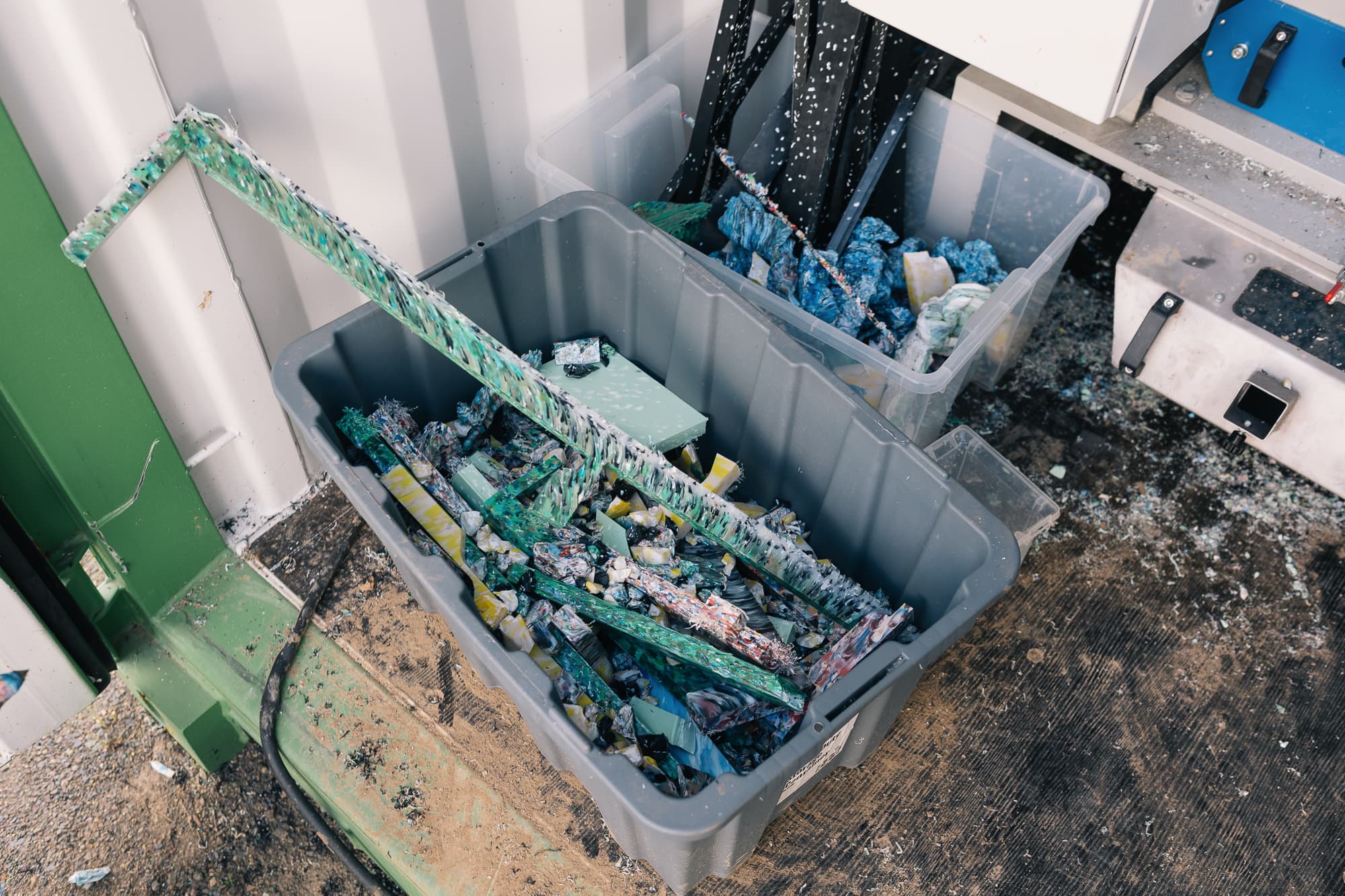 Tub of freshly shredded HDPE chip coming out of the granulator