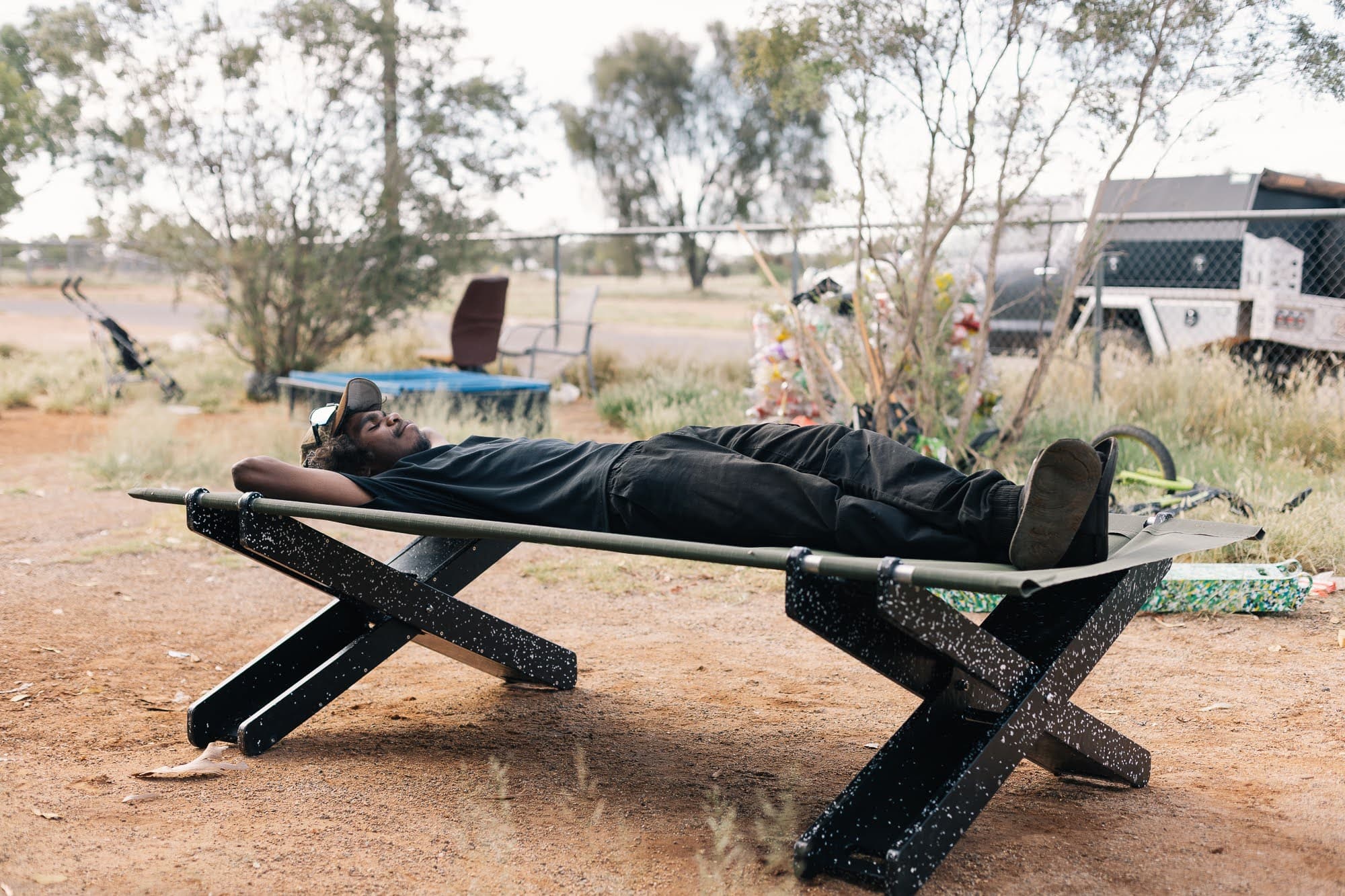 Person resting on Stretch Bed in the outback