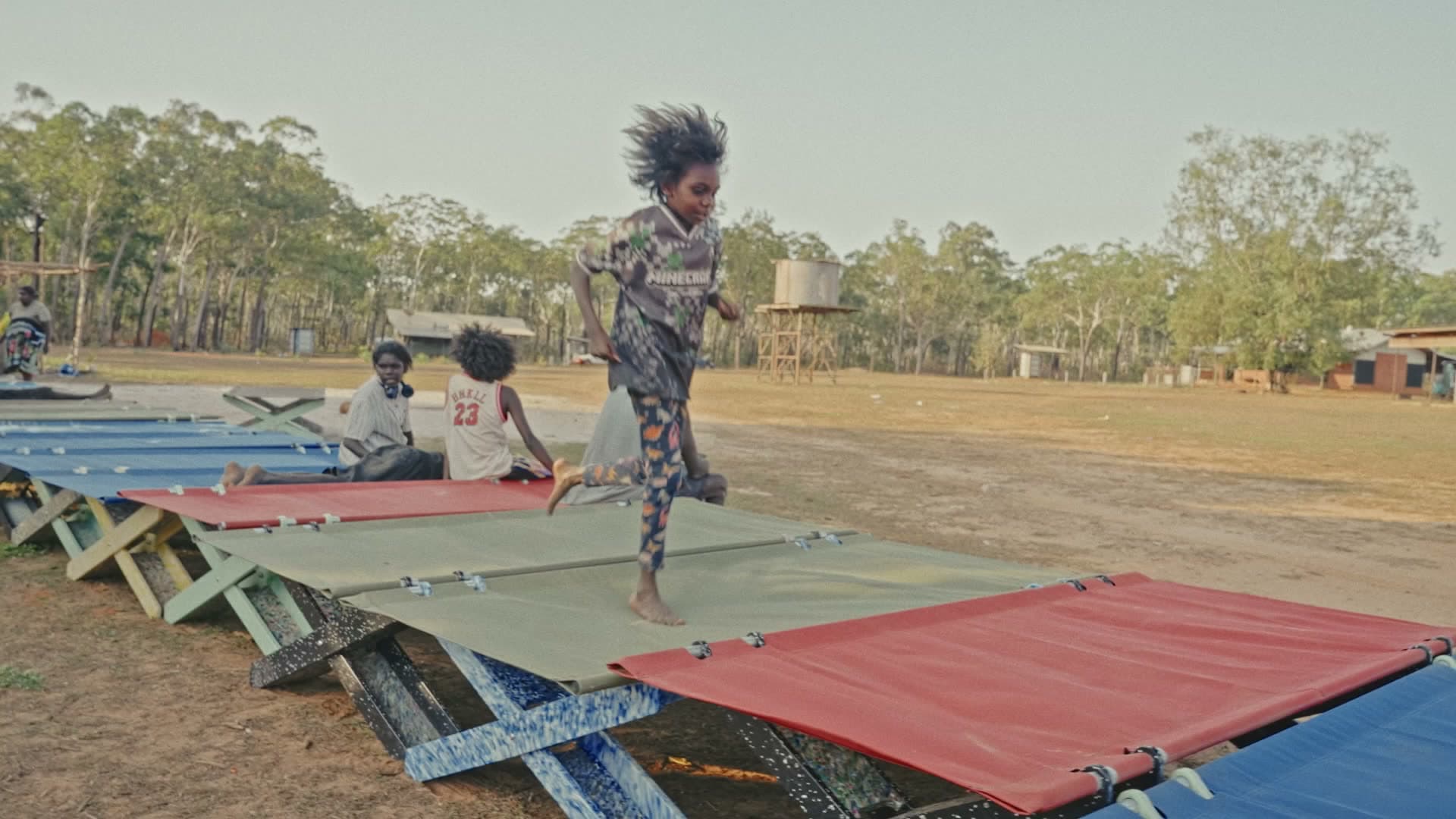 The run of beds outside the school, Maningrida