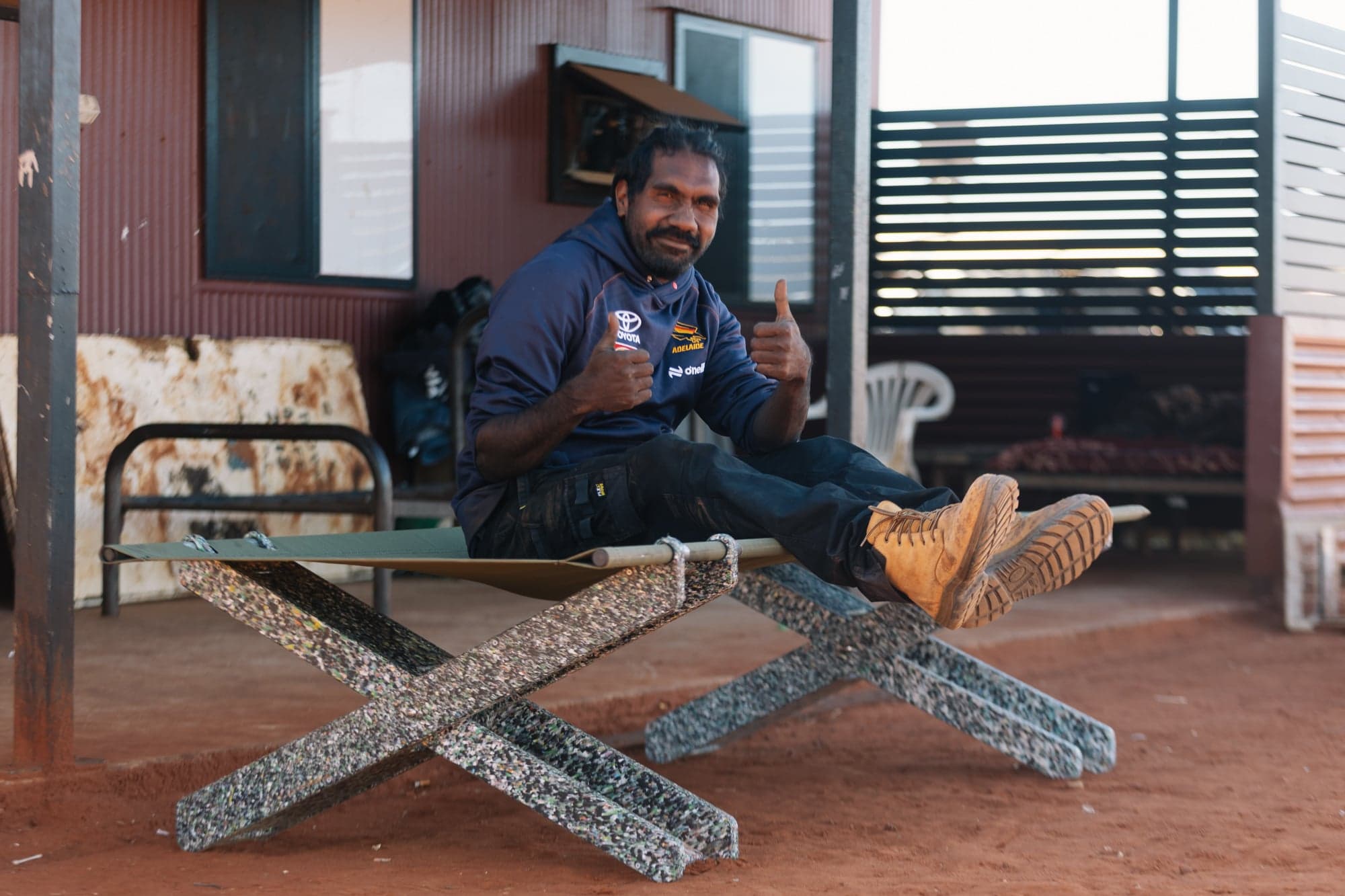 Community members assembling Stretch Beds at Utopia Homelands